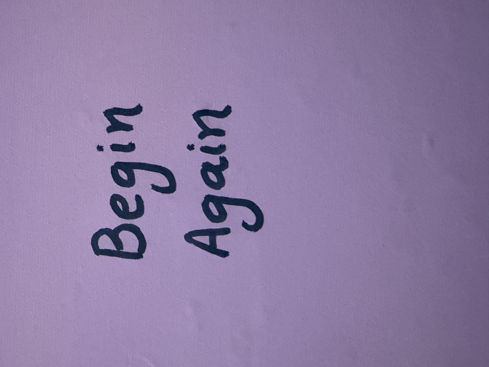 Close-up of the dark layered pour beneath the drips on Begin Again